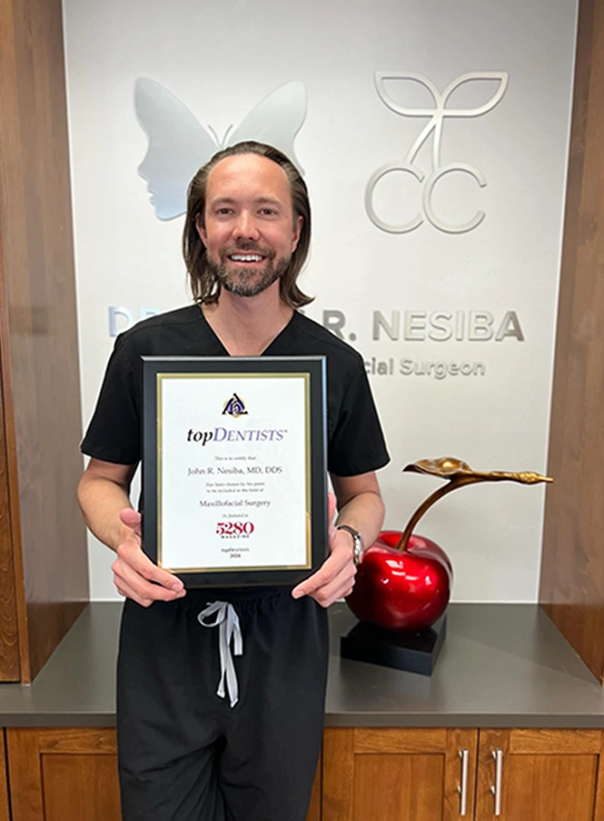 Dr. Nesiba with a topDentists award